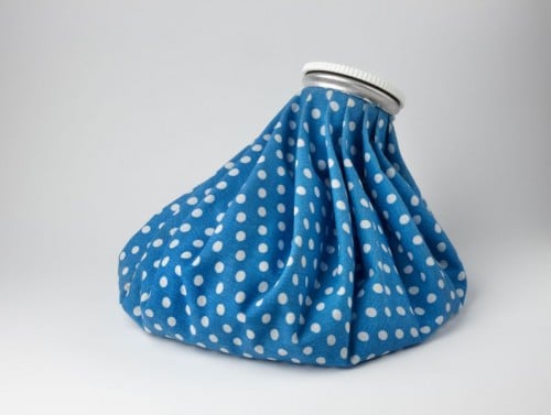 A blue ice pack with white polka dots