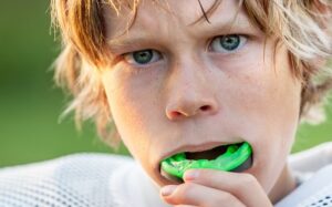 little boy with mouthguard